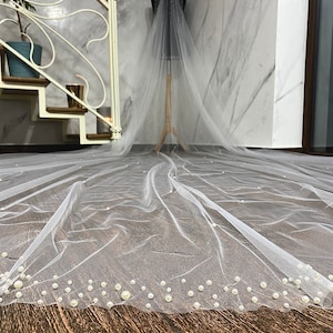 Wedding Veil With A Scattering Of Pearl With Pearls Border.