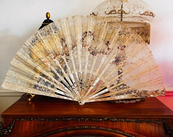 An exquisite antique hand-painted fan with cherubs, dating back to 19th Century fan made by Faucon of Paris France