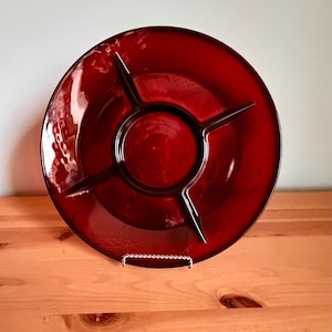 May include: A set of three ceramic mugs with a speckled, matte finish. The mugs are in shades of cream, light gray, and dark gray. Each mug has a simple, minimalist design, perfect for coffee or tea.