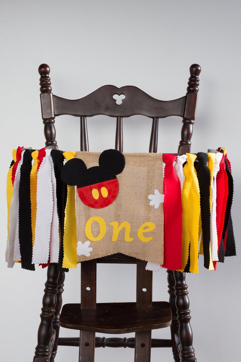 Mickey Ears In Brown Burlap And Yellow Black And Red Ribbon Makes Cute Mickey Mouse Party Banner High Chair For Boy 1st Birthday