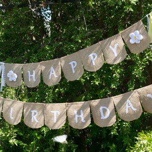 Happy Birthday Banner With White Flowers and Yellow Ribbons Makes