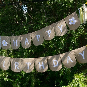 Happy Birthday Banner With White Flowers and Yellow Ribbons Makes