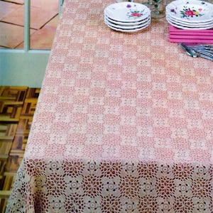 May include: A white ceramic mug with a black handle and the text "But First, Coffee" in a bold, black font. The mug is set against a blurred background, suggesting a cozy setting. The mug appears to be approximately 4 inches tall.