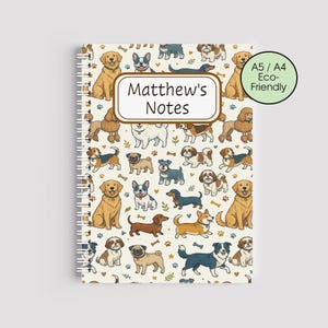 May include: A cream-coloured spiral-bound notebook with a repeating pattern of cartoon dogs. The notebook has the text "Matthew's Notes" and a green circle with the text "A5 / A4 Eco-Friendly".