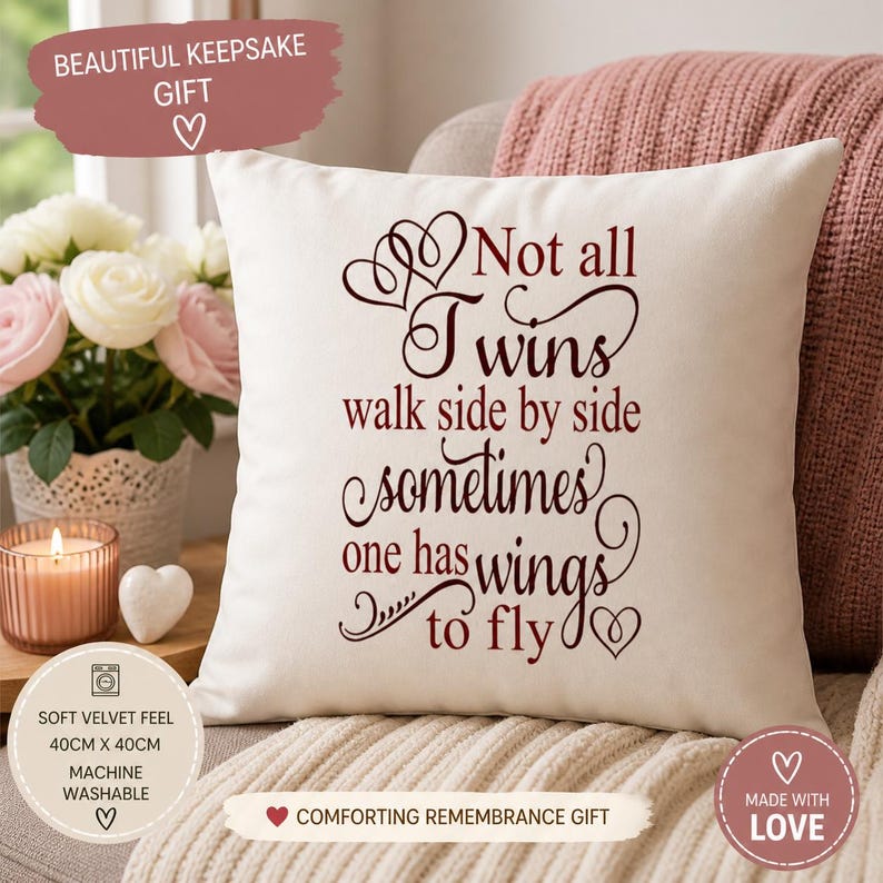 May include: Cream-colored square pillow with the text "Not all Twins walk side by side sometimes one has wings to fly" in burgundy script. The pillow is 15.75 x 15.75 inches and made of soft velvet. A comforting remembrance gift.