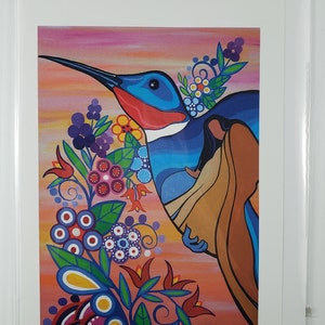 May include: A colourful painting of a hummingbird with a woman holding a baby in its wings. The hummingbird is flying over a field of flowers. The painting is done in a style that is reminiscent of Native American art. The artist's signature, "Pam Caillou", is in the bottom right corner of the painting. The title of the painting, "Hummingbirds", is in the bottom left corner.