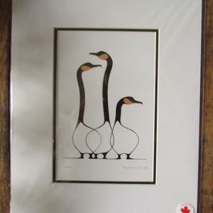 May include: A framed print of a black and white stylized illustration of three geese with orange beaks. The print is titled "Royauman Chief" and is signed "T. Royauman".