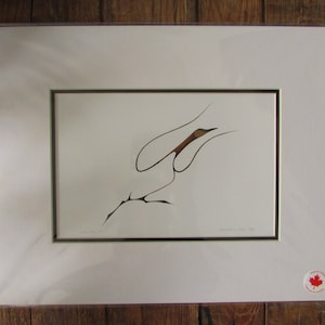 May include: A framed print of a stylized black and brown bird in flight. The print is titled "Swoop for the Sky" and signed "Ravensten, 2001".