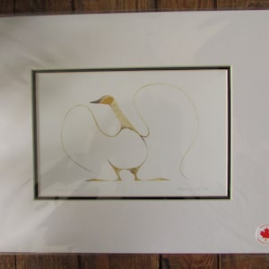 May include: A framed print of a stylized bird with a yellow head and body, and white wings. The bird is standing on a white background with a black frame.