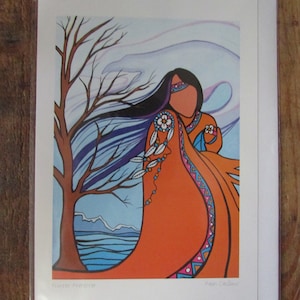 May include: A colourful print of a woman in a traditional orange dress with geometric patterns, standing in a winter landscape with a bare tree and blue water. The print is titled "Winter Dreamer" and signed "Ryan Caldwell".