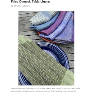 May include: A set of woven placemats and napkins in various shades of blue, green, and yellow. The placemats and napkins feature a repeating geometric pattern. The text "False Damask Place Mats and Napkins Loom: 8-shaft" is visible in the image.