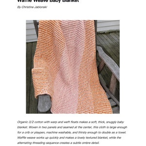 May include: Waffle weave baby blanket in shades of orange and pink, draped over a wooden chair. The blanket is made of soft, textured cotton and features the text "Waffle Weave Baby Blanket" and the name "Christine Jablonski".