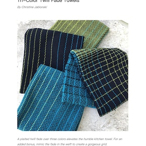 May include: Three kitchen towels woven in a twill fade pattern. The towels are black with green and blue stripes. The towels are folded and stacked on top of each other. The text "Tri-Color Twill Fade Towels: 4-shaft version" is at the bottom of the image.