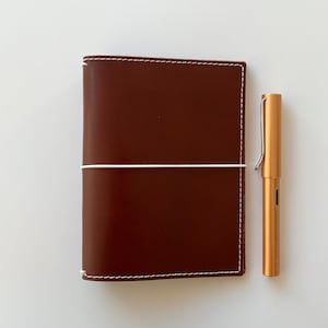 A6 cover travel notebook, genuine ebony full grain leather briefcase with elastic closure and pockets, FREE notebook and cotton bag.