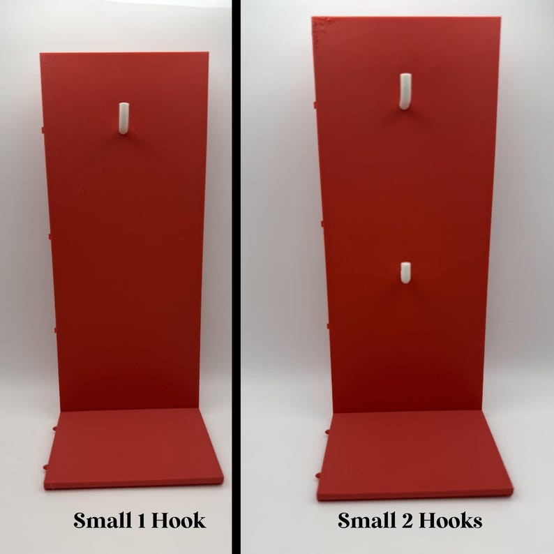 May include: Two red display stands with white hooks. The stand on the left has one hook and the stand on the right has two hooks. The text "Small 1 Hook" and "Small 2 Hooks" are at the bottom of each stand.
