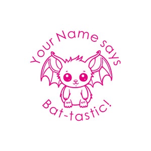 May include: Pink cartoon bat with big eyes and wings. The text around the bat says "Your Name says Bat-tastic!"