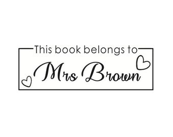 May include: Black and white bookplate with the text "This book belongs to" and the name "Mrs. Brown" in cursive. Two small hearts are on either side of the name.
