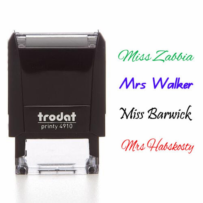 May include: A black self-inking stamp with the text "trodat printy 4910" on the front. The stamp is used to create custom labels with the names "Miss Zabbia", "Mrs Walker", "Miss Barwick", and "Mrs Habskosty" in different colors.