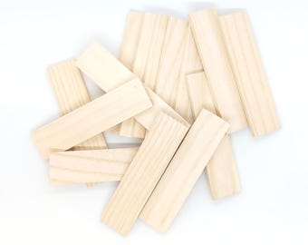 May include: A pile of natural wood craft sticks, perfect for building, crafting, or creating art projects.