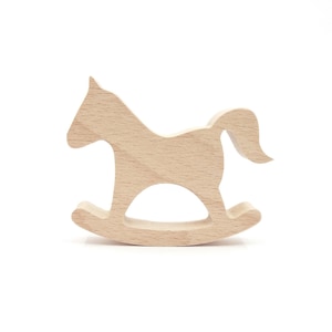 May include: A light brown wooden rocking horse toy. The toy is cut from a single piece of wood, featuring a horse silhouette with a curved base for rocking. The design is simple and classic, suitable for young children. The toy is made of wood.