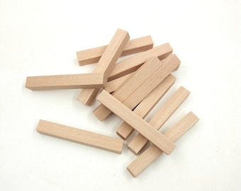 May include: A pile of natural wood craft sticks, perfect for arts and crafts projects. The sticks are approximately 1/4 inch thick and 6 inches long.