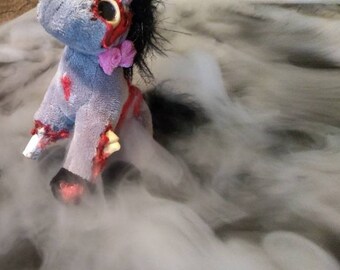 evil unicorn doll