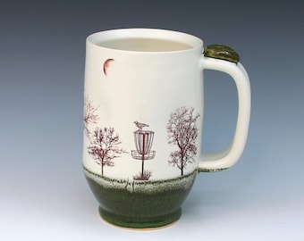 Hand-Thrown Ceramic Mug with Disc Golf & Trees Design – Folk Art Pottery