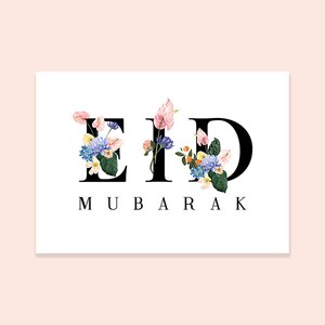 May include: A white card with the word "Eid Mubarak" written in black letters. The letters are decorated with colorful flowers.