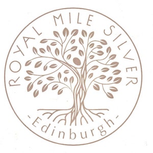 May include: A circular logo with a brown tree design and the text "Royal Mile Silver - Edinburgh".