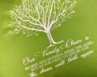 May include: Green throw pillow with white embroidery of a tree and the text "Our Family Chain is BROKEN AND NOTHING SEEMS THE SAME, BUT AS GOD CALLS US ONE BY ONE the chain will link again".