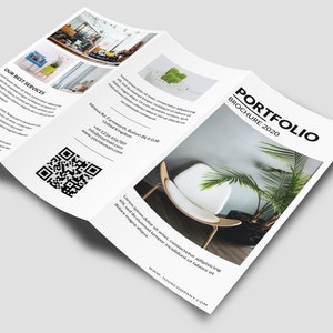 May include: A tri-fold brochure with a white background and black text. The front cover features the word "PORTFOLIO" in a large, bold font, followed by "BROCHURE 2020" in a smaller font. The brochure is folded in thirds, and the front cover is visible. The brochure is lying on a white surface.