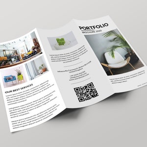 May include: A tri-fold brochure with a white background and black text. The brochure is titled "Portfolio Brochure 2020". The front of the brochure features a photo of a white chair with a green plant in the background. The inside of the brochure features photos of interior design spaces and a QR code. The brochure also includes contact information for the business.