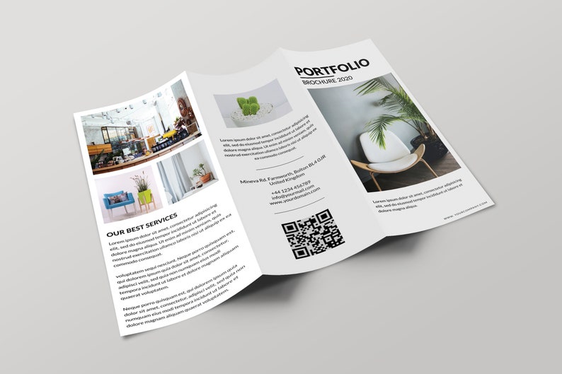 May include: A tri-fold brochure with a white background and black text. The brochure is titled "Portfolio Brochure 2020". The front of the brochure features a photo of a white chair with a green plant in the background. The inside of the brochure features photos of interior design spaces and a QR code. The brochure also includes contact information for the business.