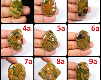 May include: Nine different cabochon gemstones with a green, brown, and white pattern. The gemstones are labeled 1a through 9a.