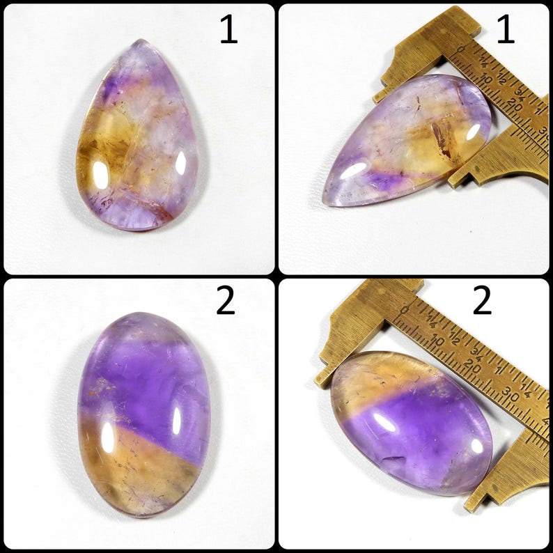 May include: Four gemstones with a mix of purple, yellow, and clear colors. Two are teardrop-shaped, and two are oval. A brass caliper is used to measure two of the stones. The gemstones have a polished, glossy finish.