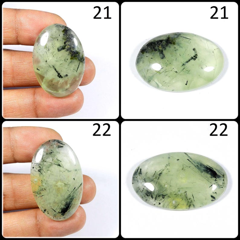 May include: Four oval-shaped green and black gemstone cabochons. The cabochons are approximately 21 mm and 22 mm in size.