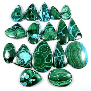 May include: A collection of 16 green and blue malachite cabochons, some with a teardrop shape and others oval, with intricate patterns and swirls.