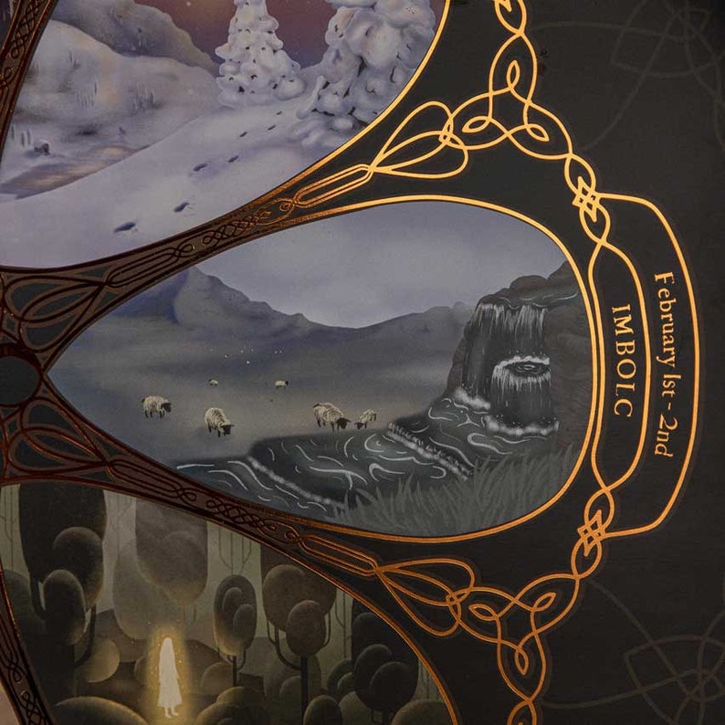 May include: A black and gold circular design with a Celtic knot pattern. The design features a scene of a waterfall and sheep in a landscape. The text "February 1st-2nd IMBOLC" is written in gold lettering.