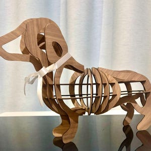 Plantilla de perro salchicha en 3D. Descarga digital de plantilla en formato PDF SVG para crear una escultura moderna. Utilízala con cortadora láser, fresadora CNC o sierra de calar.