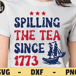 May include: A white t-shirt with a blue and red graphic that says "Spilling the Tea Since 1773". The graphic also includes a red, white, and blue stars and a blue ship.