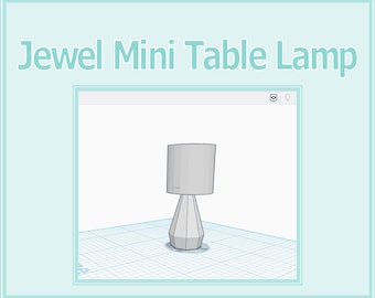 May include: A gray table lamp with a geometric base and a cylindrical lampshade. The lamp is on a white grid background.