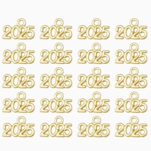 May include: Twenty gold-colored metal charms with the year 2025 printed on each charm. The charms have a small loop at the top for attaching to a necklace, bracelet, or other jewelry.