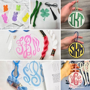 May include: A set of four needlepoint ornaments with different colored monograms. The ornaments are round and have a white background. The monograms are in pink, blue, green, and navy blue.