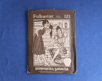May include: Folkwear Ethnic Patterns sewing pattern number 121, featuring a black and white illustration of two women wearing traditional Guatemalan clothing. The pattern is titled "Guatemalan Gabacha" and includes instructions for dress and apron with sleeve options, sewing instructions, and traditional decorative techniques.