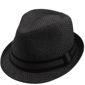 May include: A black fedora hat with a small white polka dot pattern and a black ribbon band.