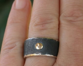 Guldklump, svart silverring