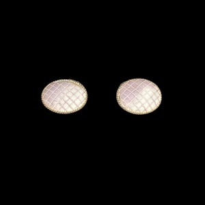 May include: A pair of small, round, white earrings with a delicate, light purple, grid pattern.