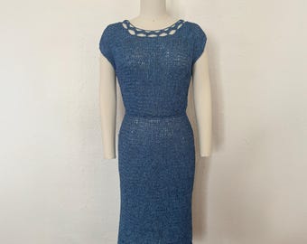 May include: A blue crochet dress with a crocheted neckline and a fitted silhouette.