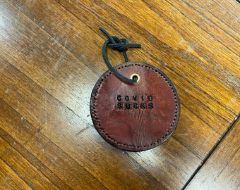 COVID sucks leather ornament