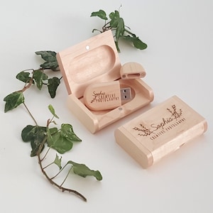 May include: A wooden box with a sliding lid, containing a small wooden USB drive with the text "Sophia Creative Photography" engraved on it. The box is also engraved with the text "Sophia Creative Photography" and a floral design.